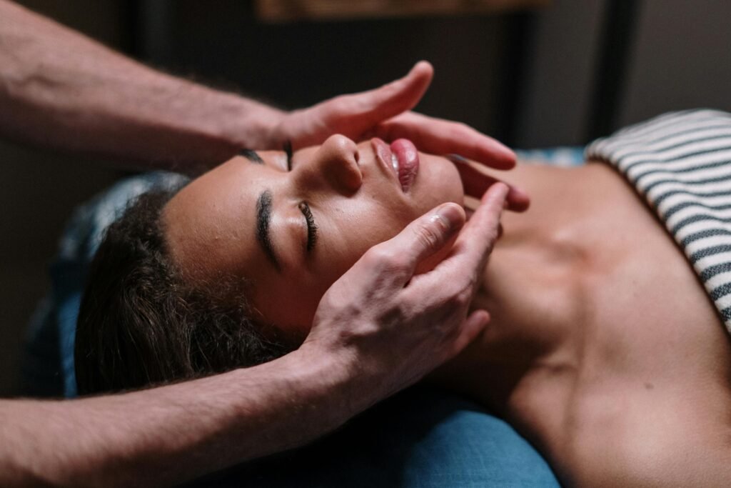 pexels-photo-3997982-3997982 Close-up of a woman receiving a soothing facial massage in a serene spa environment.