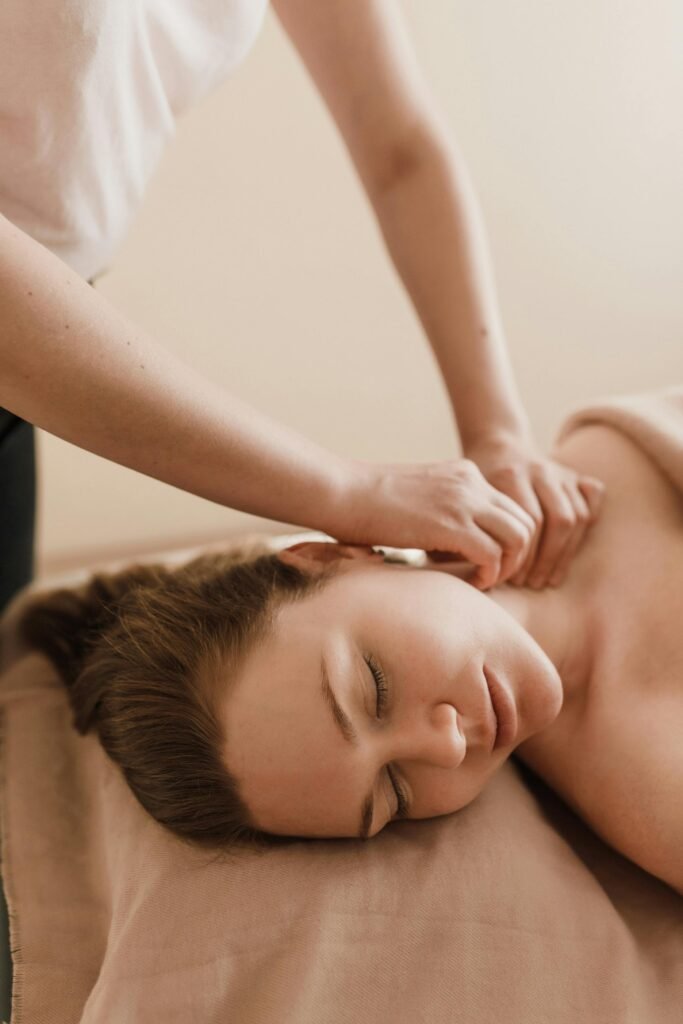 Woman enjoying a soothing massage in a serene spa setting. Ultimate relaxation.